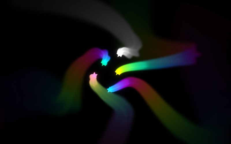 Five small stars near the middle of a black picture, each with a long curving trail that changes colour through the rainbow as it sweeps outwards